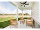 Inviting covered patio with comfortable seating, ceiling fan, and beautiful neighborhood views at 138 Rock Island Rd, Westfield, IN 46069