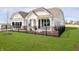 Charming home with a well-manicured lawn and black iron fence at 138 Rock Island Rd, Westfield, IN 46069
