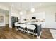 Modern kitchen with a large island, white cabinetry, and stainless steel appliances at 138 Rock Island Rd, Westfield, IN 46069