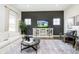Comfortable living room with dark accent wall, media cabinet, and plush area rug at 138 Rock Island Rd, Westfield, IN 46069
