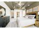 Spacious main bedroom featuring a tray ceiling, modern decor, and plush gray carpet at 138 Rock Island Rd, Westfield, IN 46069