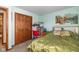 Bedroom with green walls, green comforter, and double door closet at 1547 Millridge Dr, Greenwood, IN 46143