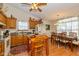 Eat-in kitchen with classic cabinets, granite countertops, stainless appliances, and a cozy breakfast nook at 1547 Millridge Dr, Greenwood, IN 46143