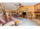 Inviting living room with a cozy brick fireplace, plush leather seating, and ample space for entertaining at 1547 Millridge Dr, Greenwood, IN 46143