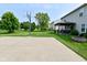 A beautiful backyard featuring a basketball court, gazebo and expansive lawn for outdoor activities at 1744 Salina Dr, Avon, IN 46123