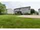 A well-manicured lawn leads up to a house with a backyard basketball court and gazebo at 1744 Salina Dr, Avon, IN 46123