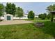 Large backyard featuring well-maintained lawn, outdoor basketball court and shed at 1744 Salina Dr, Avon, IN 46123