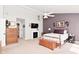 Bedroom with fireplace, TV, and neutral color palette at 1744 Salina Dr, Avon, IN 46123