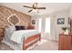 Inviting bedroom boasting exposed brick accent wall, large windows, and cozy ambiance at 1744 Salina Dr, Avon, IN 46123