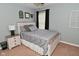 Comfortable bedroom featuring neutral tones, plush bedding, and a stylish bedside table at 1744 Salina Dr, Avon, IN 46123