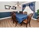 Elegant dining room featuring stylish chandelier and window with elaborate curtains at 1744 Salina Dr, Avon, IN 46123