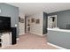 Carpeted hallway with neutral colors leads to multiple rooms with ceiling fan at 1744 Salina Dr, Avon, IN 46123