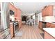 Spacious kitchen featuring stainless appliances, light countertops, wood cabinets and adjacent dining area at 1744 Salina Dr, Avon, IN 46123