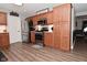 Kitchen features stainless appliances, light countertops, wood cabinets, and hardwood style floors at 1744 Salina Dr, Avon, IN 46123