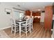 Bright kitchen with dining area featuring stylish chairs and view of the cooking space at 1744 Salina Dr, Avon, IN 46123