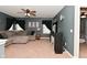 Cozy living room features plush seating, a ceiling fan, and streaming sunlight at 1744 Salina Dr, Avon, IN 46123