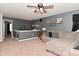 Open living room has a ceiling fan, carpet, and modern decor at 1744 Salina Dr, Avon, IN 46123
