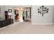 Open-concept living room with plush carpet and seamless flow into other areas at 1744 Salina Dr, Avon, IN 46123