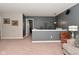 Carpeted living room with open space features a ceiling fan and neutral decor at 1744 Salina Dr, Avon, IN 46123