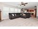 Open-concept living room with plush sectional and seamless flow into the kitchen at 1744 Salina Dr, Avon, IN 46123