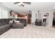 Comfortable living room with plush sectional and seamless flow into the kitchen at 1744 Salina Dr, Avon, IN 46123