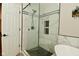 Contemporary tiled shower with glass doors, dual shower head and built-in shelves at 1744 Salina Dr, Avon, IN 46123