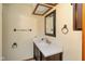 Bathroom with a white countertop vanity, a dark wood cabinet, and bronze hardware at 180 Hollowview Dr, Noblesville, IN 46060