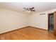 Simple bedroom with hardwood floors, a ceiling fan, and a closet entryway at 180 Hollowview Dr, Noblesville, IN 46060