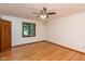Bedroom with hardwood floors, a ceiling fan, and natural light from a window at 180 Hollowview Dr, Noblesville, IN 46060