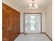 Welcoming entryway featuring light tile floors, a closet and a chandelier at 180 Hollowview Dr, Noblesville, IN 46060