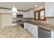 Modern kitchen featuring stainless steel appliances, granite countertops, and a window at 180 Hollowview Dr, Noblesville, IN 46060