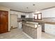 Bright kitchen with white cabinets, stainless appliances, granite counters, and kitchen island at 180 Hollowview Dr, Noblesville, IN 46060