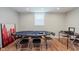 Well-lit game room with a poker table and wood-look floors, ideal for entertaining guests at 1810 S Raceway Rd, Indianapolis, IN 46231