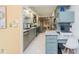 Bright kitchen featuring granite countertops, stainless steel appliances and a convenient built-in desk area at 1810 S Raceway Rd, Indianapolis, IN 46231