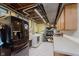 Functional laundry room with modern appliances, ample counter space, and plenty of storage at 1810 S Raceway Rd, Indianapolis, IN 46231