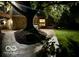 Landscaped yard with a walkway and building under a tree at night at 1810 S Raceway Rd, Indianapolis, IN 46231