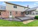 Home's back yard showcasing wooden deck, brick exterior and screened in porch at 1826 Spruce Dr, Carmel, IN 46033