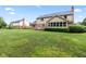 Well-maintained backyard with lush green grass and mature landscaping around the home at 1826 Spruce Dr, Carmel, IN 46033