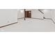 A finished basement featuring neutral carpet, a decorative beam, and stairs at 1826 Spruce Dr, Carmel, IN 46033