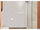 Bathroom featuring dual sinks, wood cabinets, glass shower stall, and modern lighting at 1826 Spruce Dr, Carmel, IN 46033