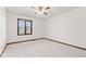 Bedroom featuring neutral walls, carpet and wood trim with window and ceiling fan at 1826 Spruce Dr, Carmel, IN 46033