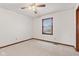 Cozy bedroom with neutral carpet, wood trim, and window with outside view at 1826 Spruce Dr, Carmel, IN 46033