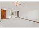 Bedroom with neutral carpet, white walls, vaulted ceiling, ceiling fan, and wood trim at 1826 Spruce Dr, Carmel, IN 46033