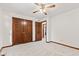 Bedroom featuring neutral carpet, closet, and wood trim at 1826 Spruce Dr, Carmel, IN 46033