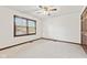 Bright bedroom with neutral carpet, large window, and classic trim at 1826 Spruce Dr, Carmel, IN 46033