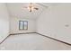 Bedroom with neutral carpet, vaulted ceilings, ceiling fan, and a double-hung window at 1826 Spruce Dr, Carmel, IN 46033