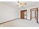 Bedroom featuring neutral carpet, closet, ceiling fan, and natural lighting at 1826 Spruce Dr, Carmel, IN 46033