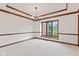 Classic dining room with natural light from large window and elegant chandelier at 1826 Spruce Dr, Carmel, IN 46033