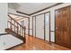 Inviting foyer with hardwood floors, a staircase with wooden banisters, and a view into other rooms at 1826 Spruce Dr, Carmel, IN 46033