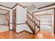 Foyer with hardwood floors, staircase with carpet, and views into other rooms at 1826 Spruce Dr, Carmel, IN 46033